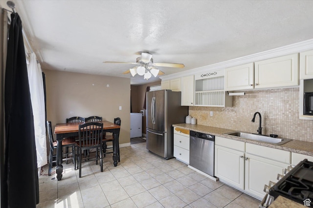 80 S 400 E, Clearfield, UT 84015 - kitchen with appliances with stainless steel finishes, a sink, light countertops, and tasteful backsplash