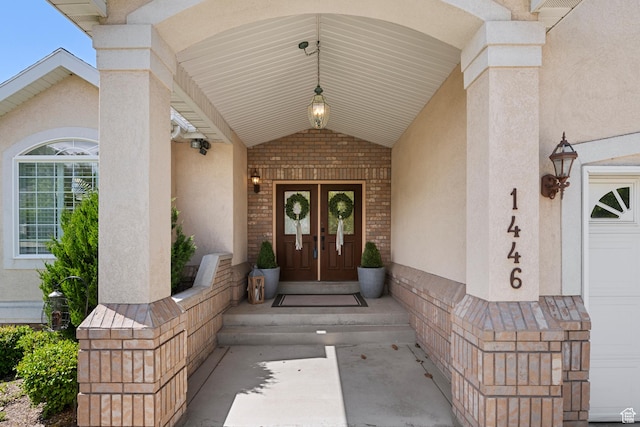 1446 E Anvil Dr, Draper, UT 84020 - property entrance with french doors, stucco siding, and brick siding