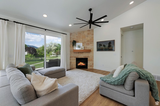 1446 E Anvil Dr, Draper, UT 84020 - living room featuring lofted ceiling, a ceiling fan, wood finished floors, recessed lighting, and a stone fireplace