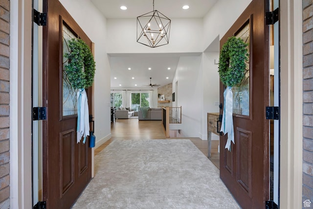 1446 E Anvil Dr, Draper, UT 84020 - foyer with wood finished floors, recessed lighting, a chandelier, and baseboards