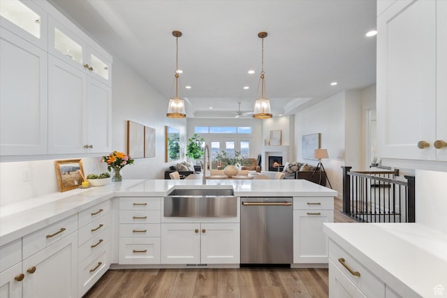 4307 N La Ringhiera Dr, Lehi, UT 84043 - kitchen featuring stainless steel dishwasher, a sink, light wood finished floors, recessed lighting, and white cabinets
