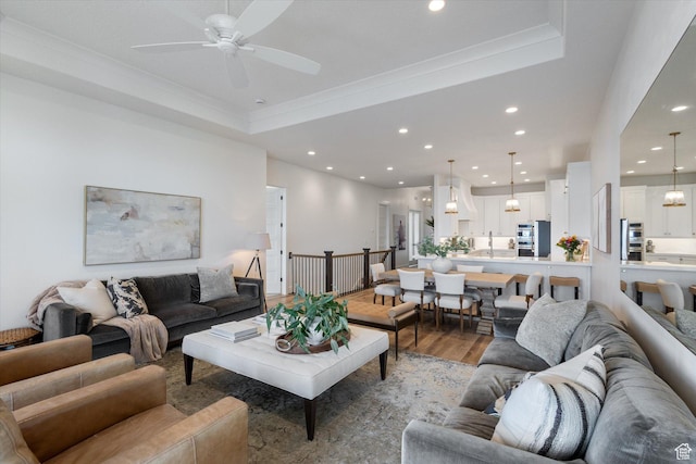 4307 N La Ringhiera Dr, Lehi, UT 84043 - living room with wood finished floors, recessed lighting, ceiling fan, crown molding, and a raised ceiling