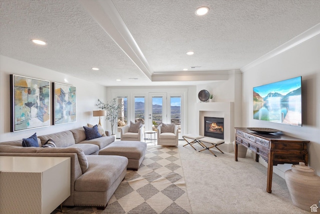 4307 N La Ringhiera Dr, Lehi, UT 84043 - living room with a textured ceiling, light colored carpet, recessed lighting, and a glass covered fireplace