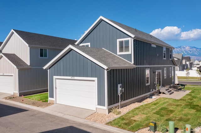 473 N Northshore Dr, Saratoga Springs, UT 84045 - modern farmhouse with roof with shingles, a garage, a mountain view, board and batten siding, and concrete driveway