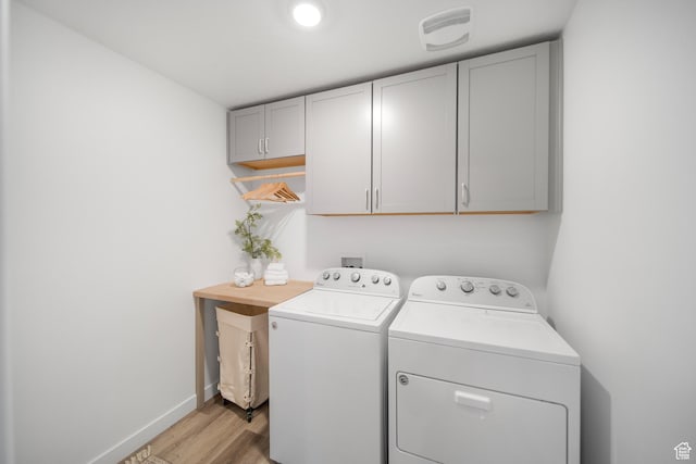 473 N Northshore Dr, Saratoga Springs, UT 84045 - washroom with independent washer and dryer, cabinet space, light wood-type flooring, and baseboards