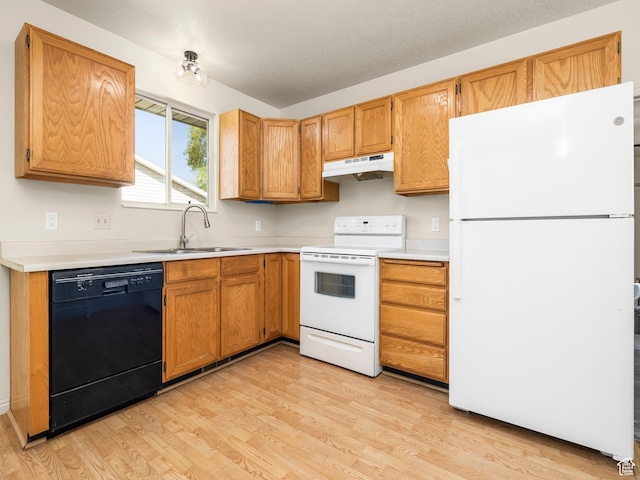 6813 S Sparrowtail Rd, West Jordan, UT 84081 - kitchen with white appliances, under cabinet range hood, a sink, light wood-type flooring, and light countertops