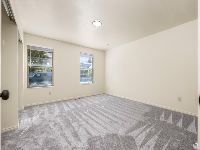 6813 S Sparrowtail Rd, West Jordan, UT 84081 - spare room with carpet floors, healthy amount of natural light, and baseboards