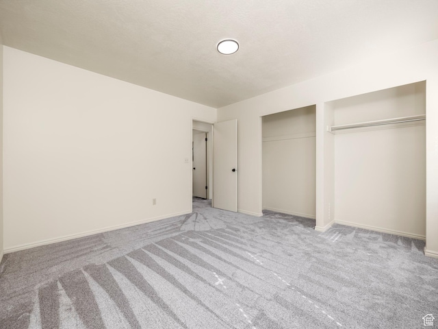6813 S Sparrowtail Rd, West Jordan, UT 84081 - unfurnished bedroom with carpet floors, multiple closets, and baseboards