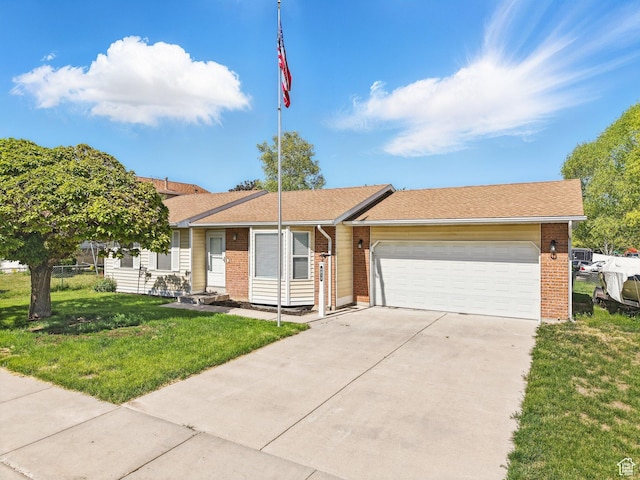 6813 S Sparrowtail Rd, West Jordan, UT 84081 - ranch-style house featuring an attached garage, brick siding, a front lawn, and concrete driveway