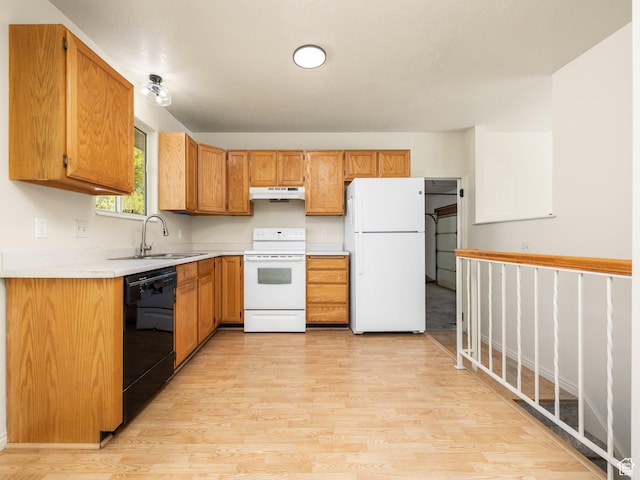 6813 S Sparrowtail Rd, West Jordan, UT 84081 - kitchen with white appliances, under cabinet range hood, a sink, light wood finished floors, and light countertops
