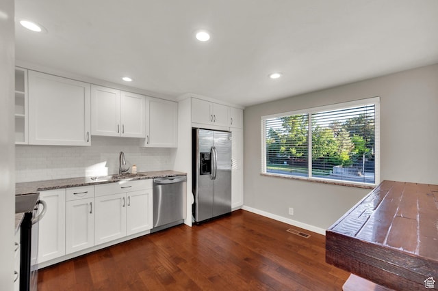 1543 Mulberry Way, Sandy, UT 84093 - kitchen featuring appliances with stainless steel finishes, a sink, baseboards, tasteful backsplash, and dark wood-style flooring