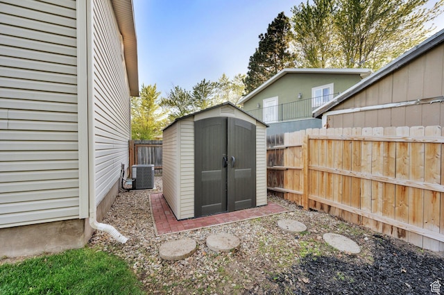 1543 Mulberry Way, Sandy, UT 84093 - view of shed featuring a fenced backyard and central air condition unit
