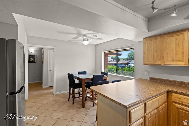 840 S 400 E Unit 46, St George, UT 84770 - kitchen with freestanding refrigerator, a ceiling fan, light tile patterned floors, a peninsula, and rail lighting