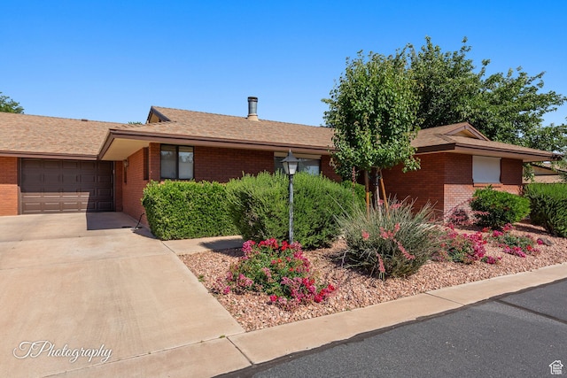 840 S 400 E Unit 46, St George, UT 84770 - ranch-style house with brick siding, concrete driveway, a garage, and a shingled roof