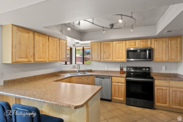 840 S 400 E Unit 46, St George, UT 84770 - kitchen featuring appliances with stainless steel finishes, a sink, a raised ceiling, and light brown cabinets