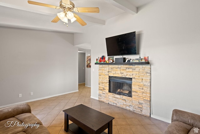 840 S 400 E Unit 46, St George, UT 84770 - living area featuring beamed ceiling, tile patterned flooring, a stone fireplace, ceiling fan, and baseboards