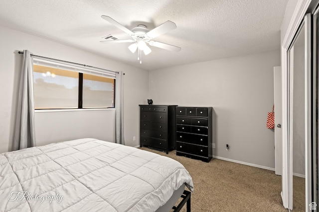 840 S 400 E Unit 46, St George, UT 84770 - bedroom featuring carpet floors, a textured ceiling, a ceiling fan, and baseboards