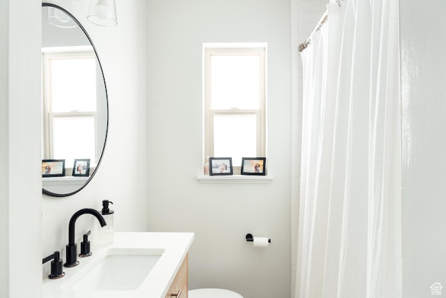 1584 E 3045 S, Salt Lake City, UT 84106 - bathroom featuring vanity, toilet, and a shower with curtain