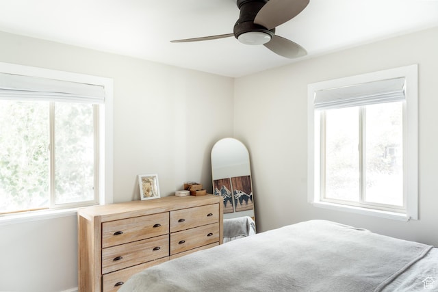 1584 E 3045 S, Salt Lake City, UT 84106 - bedroom featuring multiple windows, a ceiling fan, and baseboards