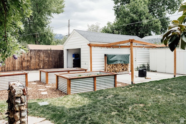1584 E 3045 S, Salt Lake City, UT 84106 - view of yard featuring a vegetable garden, a patio area, and an outbuilding