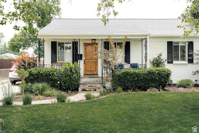 1584 E 3045 S, Salt Lake City, UT 84106 - view of front of house with a front lawn, roof with shingles, covered porch, and stucco siding