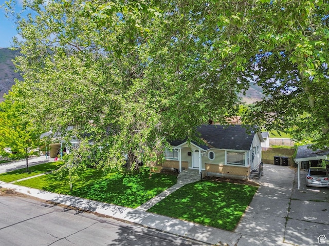 598 Brookside Dr, Springville, UT 84663 - view of front of house with a front lawn, concrete driveway, and brick siding