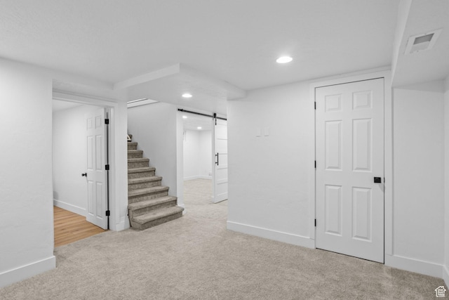 598 Brookside Dr, Springville, UT 84663 - finished below grade area featuring a barn door, carpet floors, stairway, recessed lighting, and baseboards