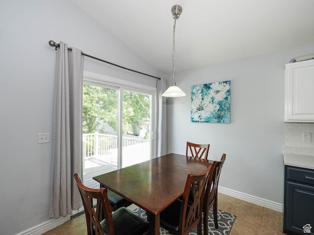 67 N Archmore St, Saratoga Springs, UT 84043 - dining area with lofted ceiling, light tile patterned floors, and baseboards