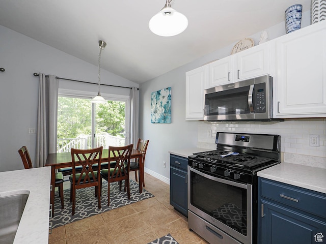 67 N Archmore St, Saratoga Springs, UT 84043 - kitchen featuring appliances with stainless steel finishes, backsplash, light countertops, blue cabinetry, and lofted ceiling