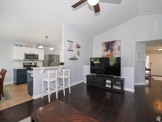 67 N Archmore St, Saratoga Springs, UT 84043 - living room with lofted ceiling, ceiling fan, hardwood / wood-style flooring, and baseboards