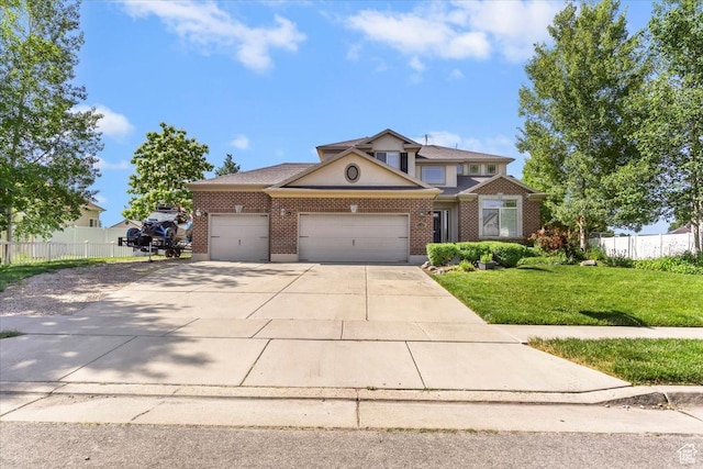 3681 W 775 N, Layton, UT 84041 - view of front of property featuring a garage, driveway, and brick siding