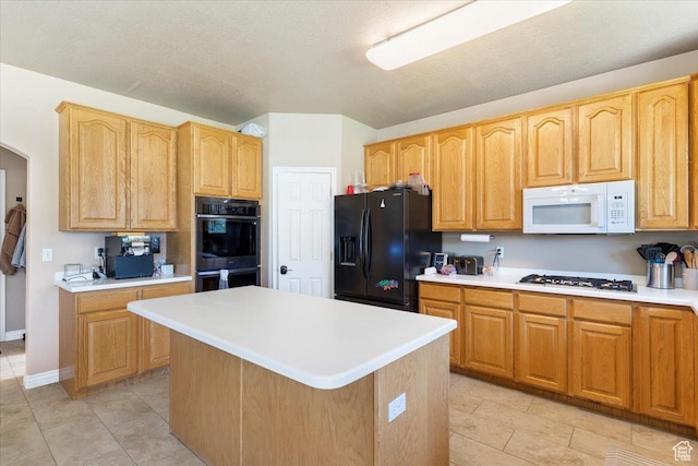 3681 W 775 N, Layton, UT 84041 - kitchen with white appliances, light countertops, a center island, light tile patterned flooring, and baseboards