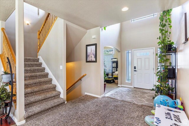 3681 W 775 N, Layton, UT 84041 - entrance foyer featuring arched walkways, stairway, carpet flooring, recessed lighting, and baseboards