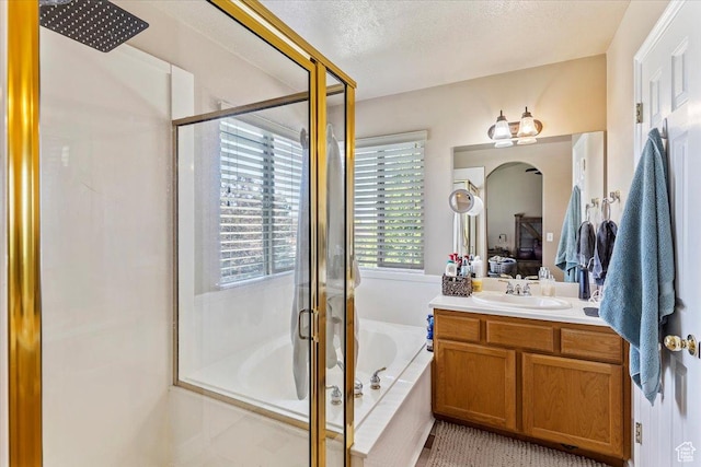 3681 W 775 N, Layton, UT 84041 - full bathroom featuring vanity, a shower stall, a garden tub, and a textured ceiling