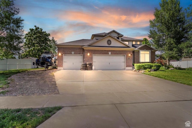 3681 W 775 N, Layton, UT 84041 - view of front of home featuring an attached garage, brick siding, and concrete driveway