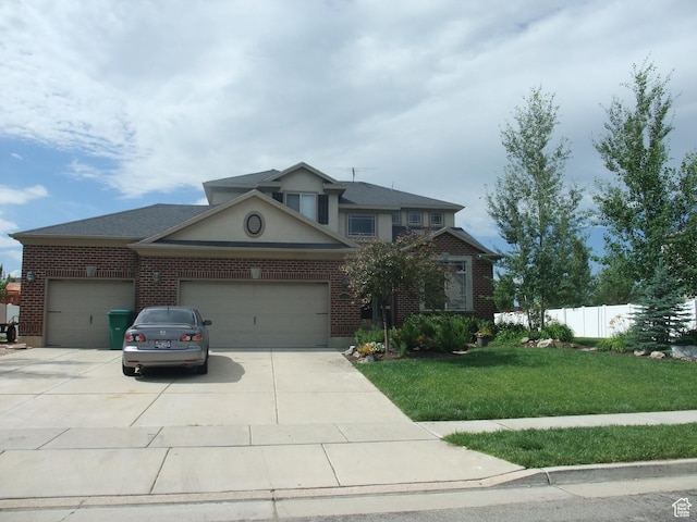 3681 W 775 N, Layton, UT 84041 - traditional-style home with a garage, driveway, and brick siding