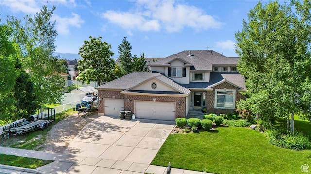 3681 W 775 N, Layton, UT 84041 - view of front of property featuring a garage, concrete driveway, and brick siding