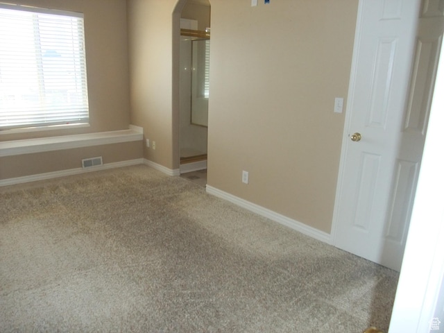 3681 W 775 N, Layton, UT 84041 - empty room with arched walkways, carpet floors, and baseboards