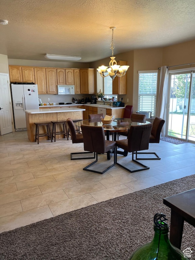 3681 W 775 N, Layton, UT 84041 - dining area with a chandelier, a textured ceiling, and light tile patterned floors