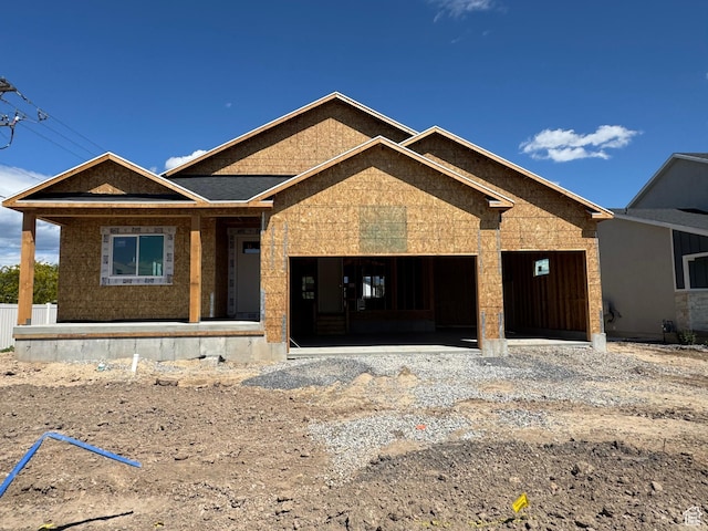 2711 S Allison Way Unit 101, Syracuse, UT 84075 - unfinished property featuring a porch, a garage, and gravel driveway