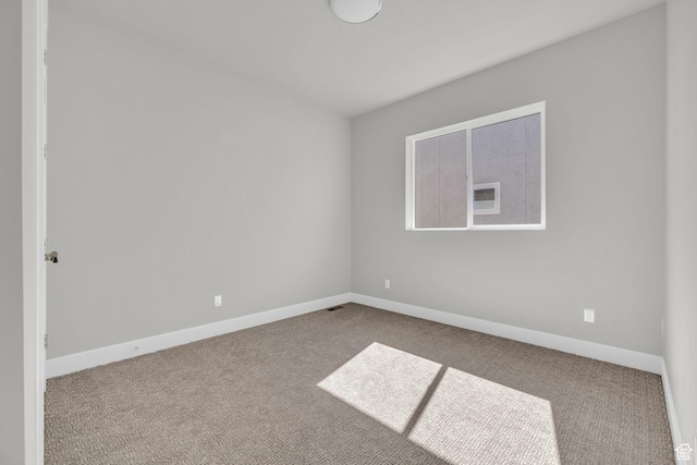 2711 S Allison Way Unit 101, Syracuse, UT 84075 - spare room with carpet and baseboards