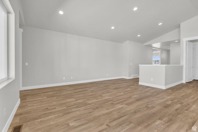 2711 S Allison Way Unit 101, Syracuse, UT 84075 - unfurnished room featuring light wood-type flooring, baseboards, recessed lighting, and vaulted ceiling