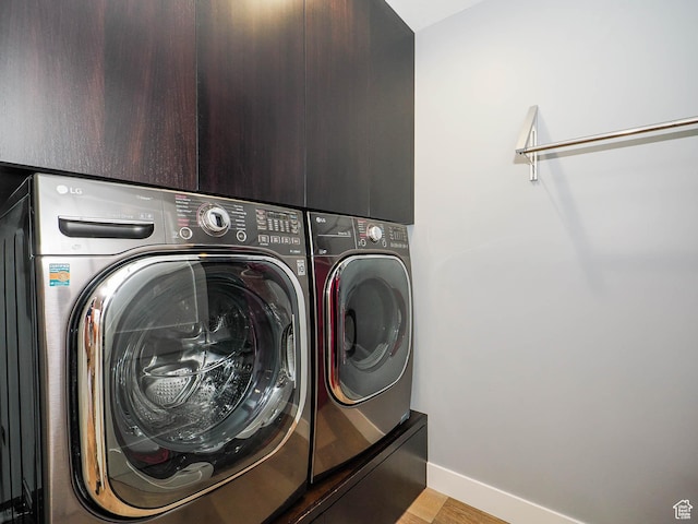 48 W 300 S Unit 2502-N, Salt Lake City, UT 84101 - laundry room featuring separate washer and dryer, light wood-type flooring, and baseboards