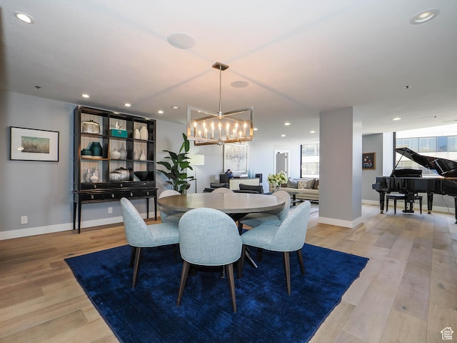 48 W 300 S Unit 2502-N, Salt Lake City, UT 84101 - dining room featuring light wood finished floors, a chandelier, recessed lighting, baseboards, and healthy amount of natural light