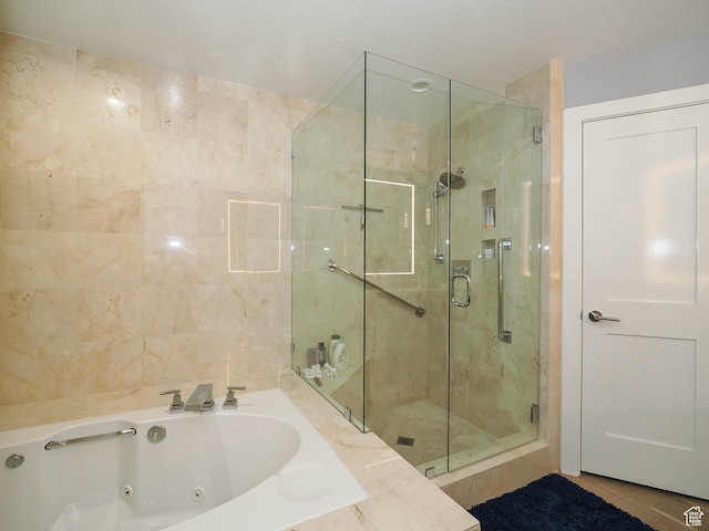 48 W 300 S Unit 2502-N, Salt Lake City, UT 84101 - full bathroom with a shower stall and a jetted tub