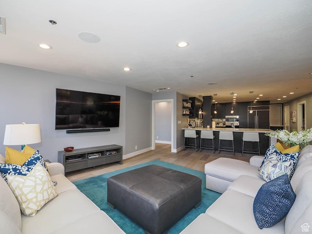 48 W 300 S Unit 2502-N, Salt Lake City, UT 84101 - living room with recessed lighting, light wood-style floors, and baseboards
