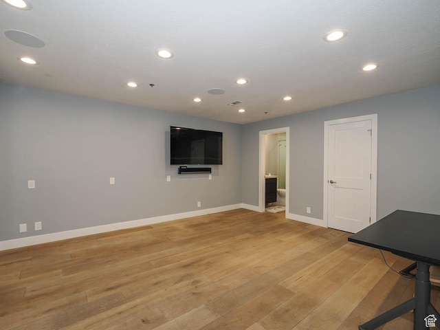 48 W 300 S Unit 2502-N, Salt Lake City, UT 84101 - basement featuring baseboards, light wood-type flooring, and recessed lighting