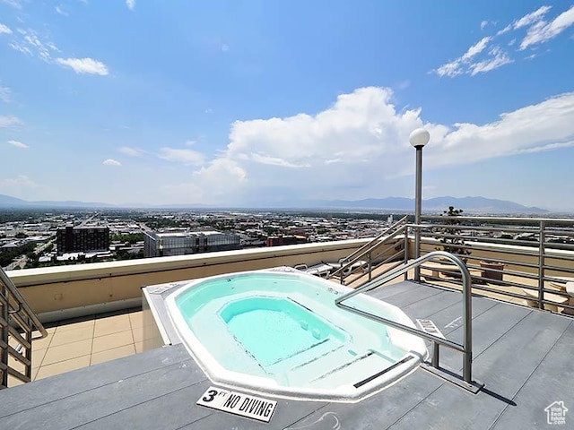 48 W 300 S Unit 2502-N, Salt Lake City, UT 84101 - view of pool with a hot tub and a mountain view