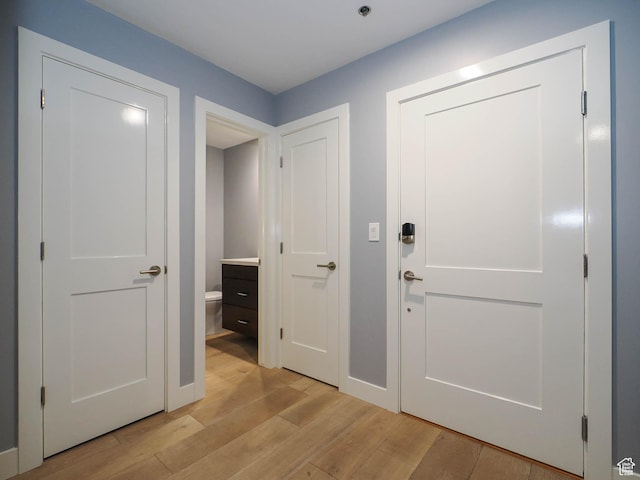 48 W 300 S Unit 2502-N, Salt Lake City, UT 84101 - hallway featuring light wood-style flooring and baseboards