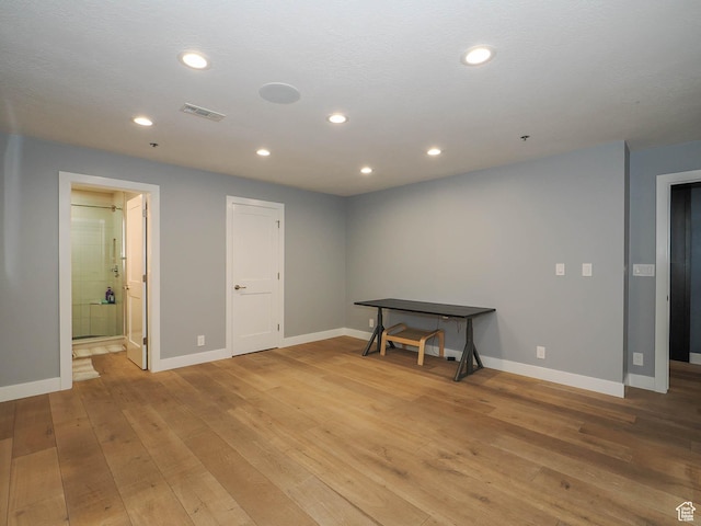 48 W 300 S Unit 2502-N, Salt Lake City, UT 84101 - basement featuring light wood-style floors, baseboards, and recessed lighting